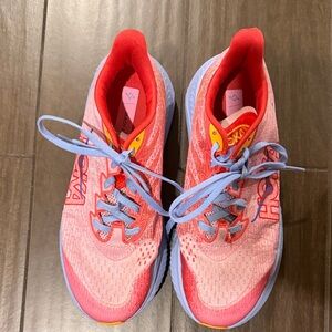Hoka Pink and Red Running Shoes with Blue Accents